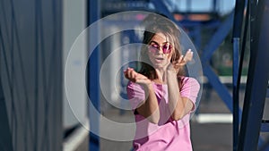 Stylish female street dancer demonstrate dance movement outdoor. Shot with RED camera in 4K