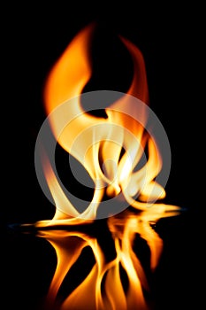 Stylish fire flames reflected in water photo
