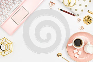 Stylish flatlay frame arrangement with pink laptop, coffee, milk holder, planner, glasses and other accessories