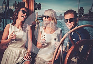 Stylish friends having fun on a yacht