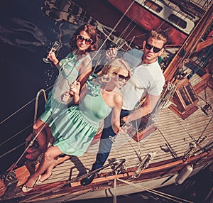 Stylish friends on a luxury yacht