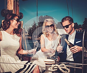 Stylish friends on a luxury yacht