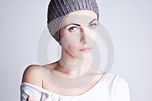 Stylish girl in a knitted hat