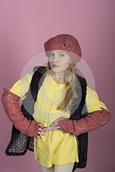 Stylish girl with pretty face on grey background. Hairdresser, skincare, casual style, denim. Little girl with long hair