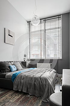 Stylish gray bedroom with double bed