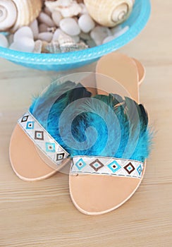 Stylish greek leather sandals with blue feathers - bohemian style
