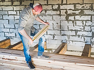 Stylish guy, working with tools on wood