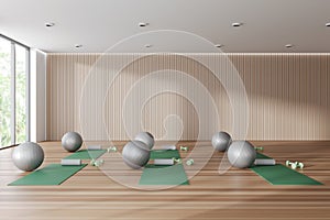 Stylish gym interior with equipment and panoramic window