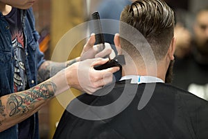 Stylish haircut in barbershop photo