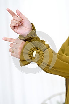 Stylish Hand Gesture and Sleeves Showing The Beautiful Asian Hijab Woman Hand