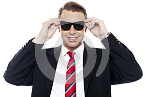 Stylish handsome businessman wearing shades