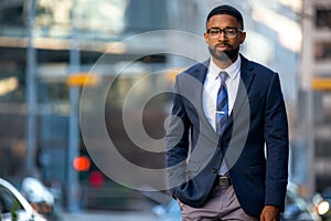 Stylish handsome modern business executive, african american banker, financial representative, suit and tie with smart glasses