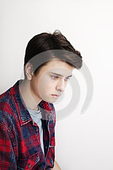 Stylish handsome young man posing. Studio shot on white background