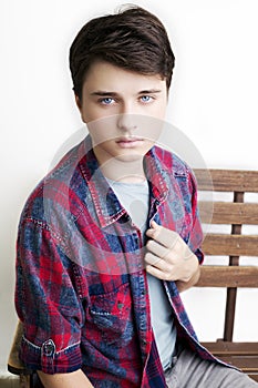 Stylish handsome young man posing. Studio shot on white background