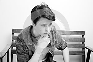 Stylish handsome young man posing on white background