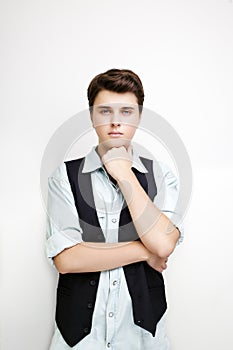 Stylish handsome young man posing on white background