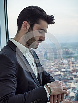 Stylish handsome young man wearing business suit