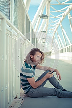 Stylish hipster model with long red hair and beard lifestyle on