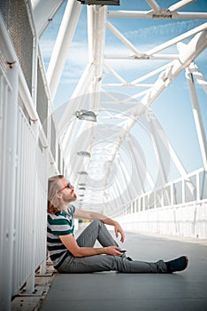 Stylish hipster model with long red hair and beard lifestyle on