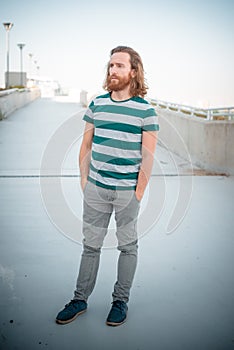 Stylish hipster model with long red hair and beard lifestyle