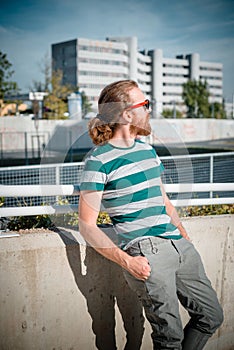 Stylish hipster model with long red hair and beard lifestyle