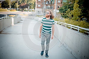 Stylish hipster model with long red hair and beard lifestyle