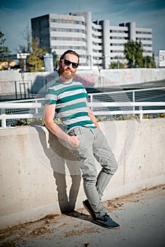 Stylish hipster model with long red hair and beard lifestyle