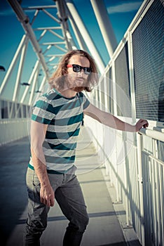 Stylish hipster model with long red hair and beard lifestyle