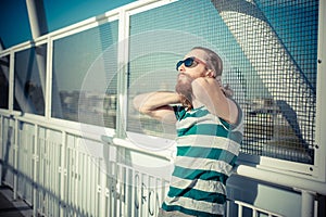 Stylish hipster model with long red hair and beard lifestyle