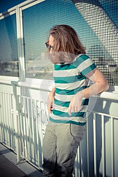 Stylish hipster model with long red hair and beard lifestyle