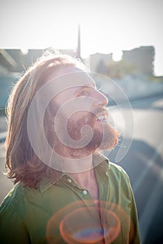 Stylish hipster model with long red hair and beard lifestyle