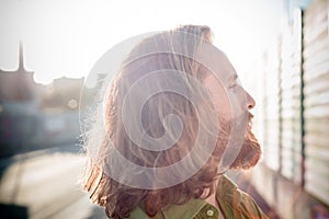 Stylish hipster model with long red hair and beard lifestyle