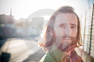 Stylish hipster model with long red hair and beard lifestyle