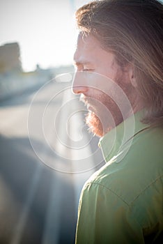 Stylish hipster model with long red hair and beard lifestyle