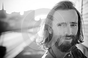 Stylish hipster model with long red hair and beard lifestyle