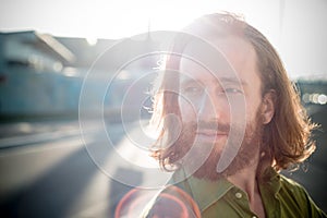 Stylish hipster model with long red hair and beard lifestyle