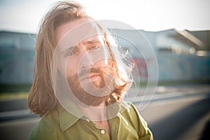 Stylish hipster model with long red hair and beard lifestyle
