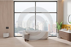 Stylish home bathroom interior with tub, toilet and sink near panoramic window