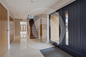 Stylish home entrance hall with tiled floor