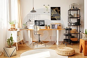 Stylish home office with pouf