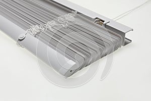 Stylish horizontal window blinds on white background