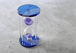 Stylish hourglass on table. Time management concept