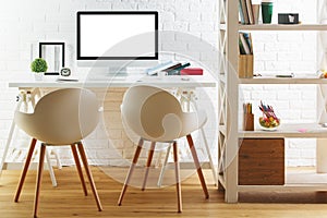 Stylish interior with blank white computer