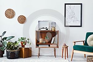 Stylish interior of living room with design wooden shelf, velvet sofa, a lot of plants, mock up poster map, vinyl recorder, book.