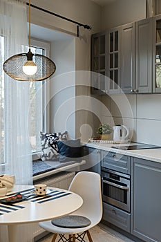 Stylish kitchen interior with window and furniture