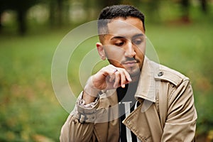 Stylish kuwaiti man at trench coat