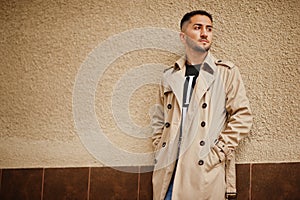 Stylish kuwaiti man at trench coat