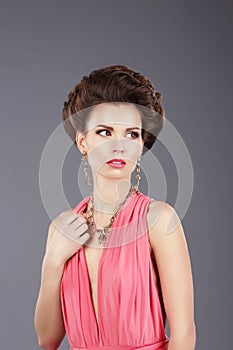 Stylish Lady in Pink Dress with Ornamentation
