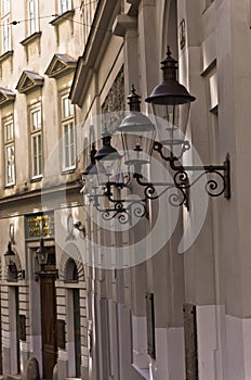 Stylish lanterns on 19th century neoclassic building, jewish quarter in Vienna