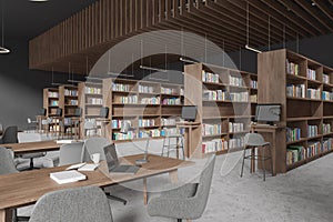 Stylish library interior with table and chairs in row, pc computer and shelf